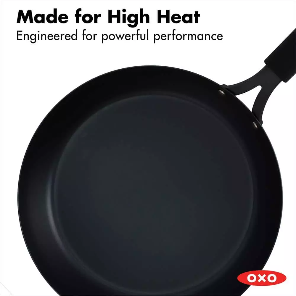 Black Steel 12 in. Pre-Seasoned Carbon Steel Induction Safe Frying Pan with Silicone Sleeve in Black by OXO 4 Black Steel 12 in. Pre-Seasoned Carbon Steel Induction Safe Frying Pan with Silicone Sleeve in Black by OXO - Image 2