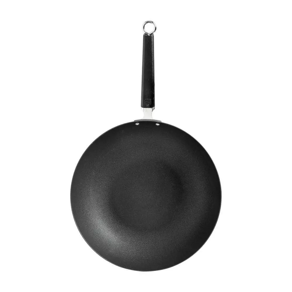 Joyce Chen Professional Series 12 in. Black Carbon Steel Excalibur Nonstick Stir Fry Pan with Phenolic Handle by Honey-Can-Do 4 Joyce Chen Professional Series 12 in. Black Carbon Steel Excalibur Nonstick Stir Fry Pan with Phenolic Handle by Honey-Can-Do - Image 3